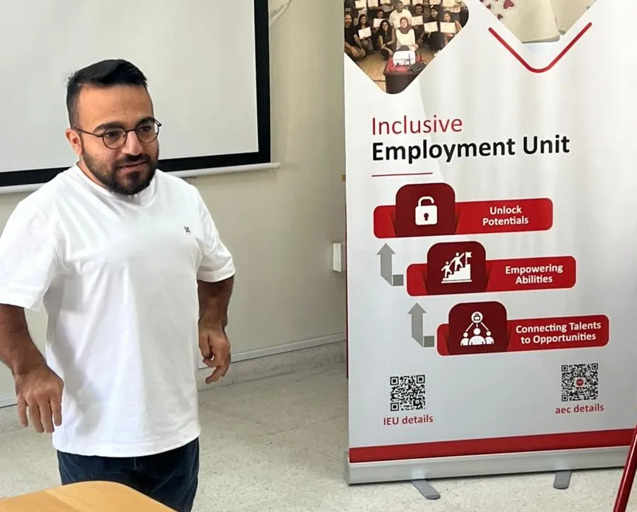 Salam speaking to the group during an Inclusive Employment Unit session.