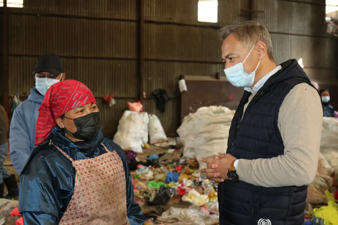 ILO Country Director in Nepal, Mr. Numan &Ouml;zcan interacting with a waste segregator at a transfer site.