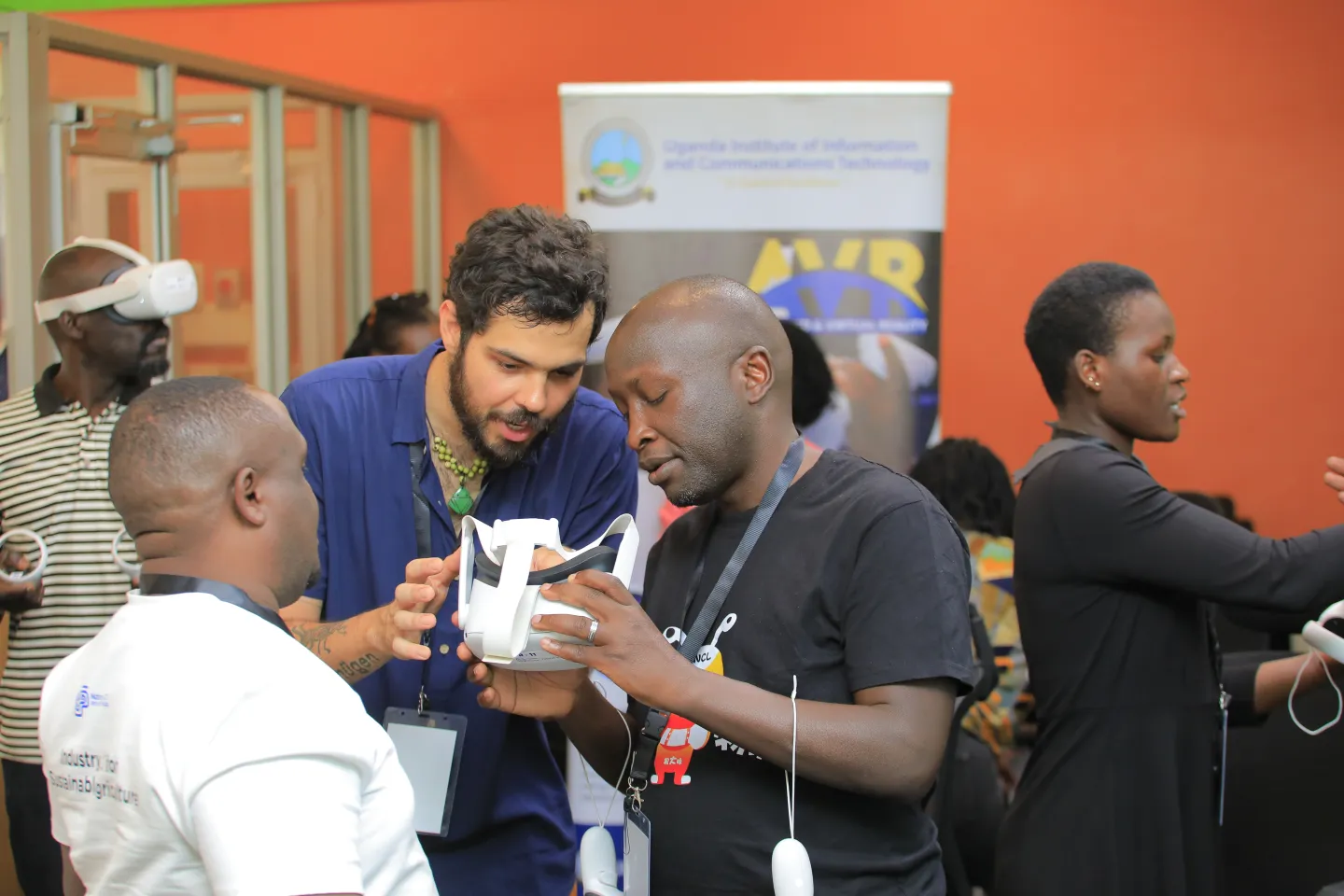 participant looking at VR headset with curiosity