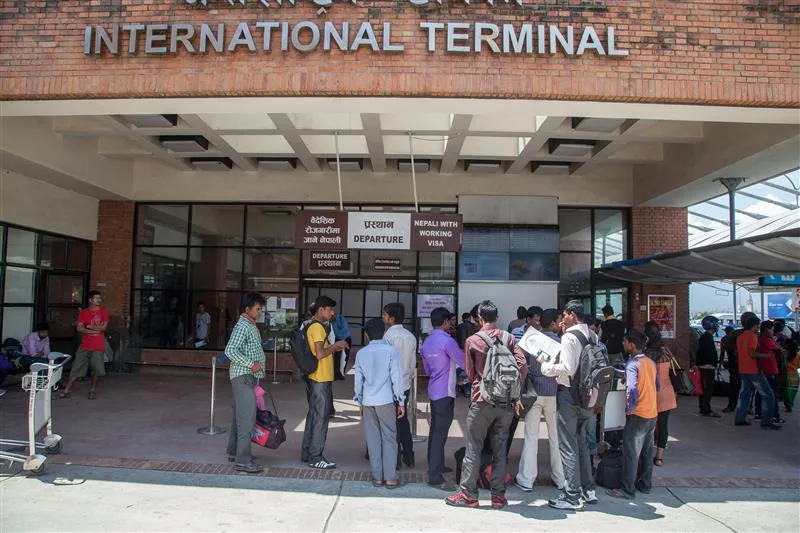 Nepali migrant workers departing from Tribhuvan International Airport, Kathmandu, representing the journey thousands take in search of decent work abroad.