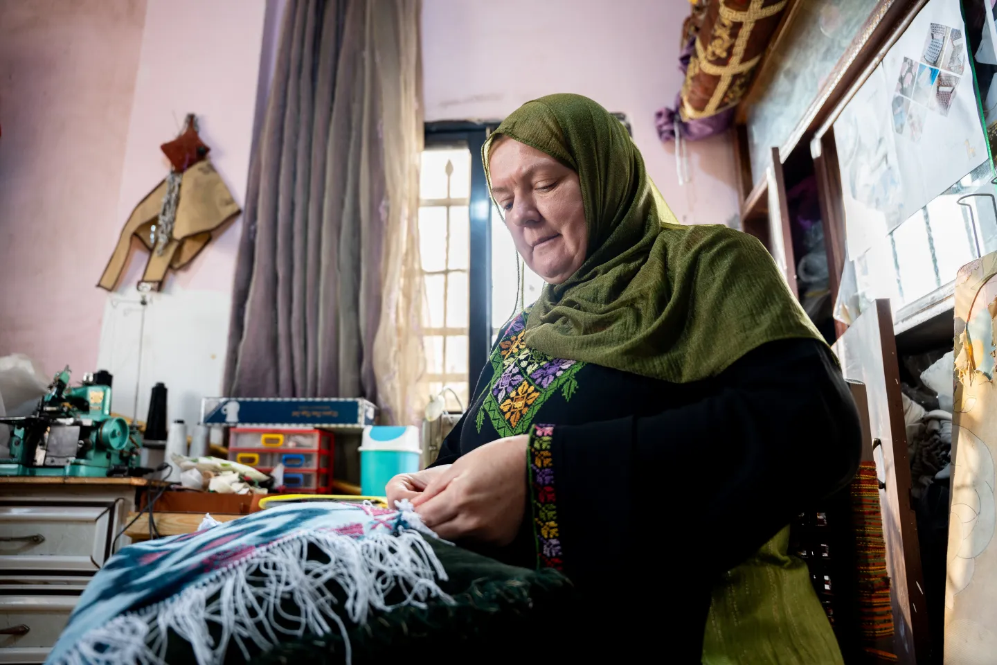 a woman working on decorative items at her home