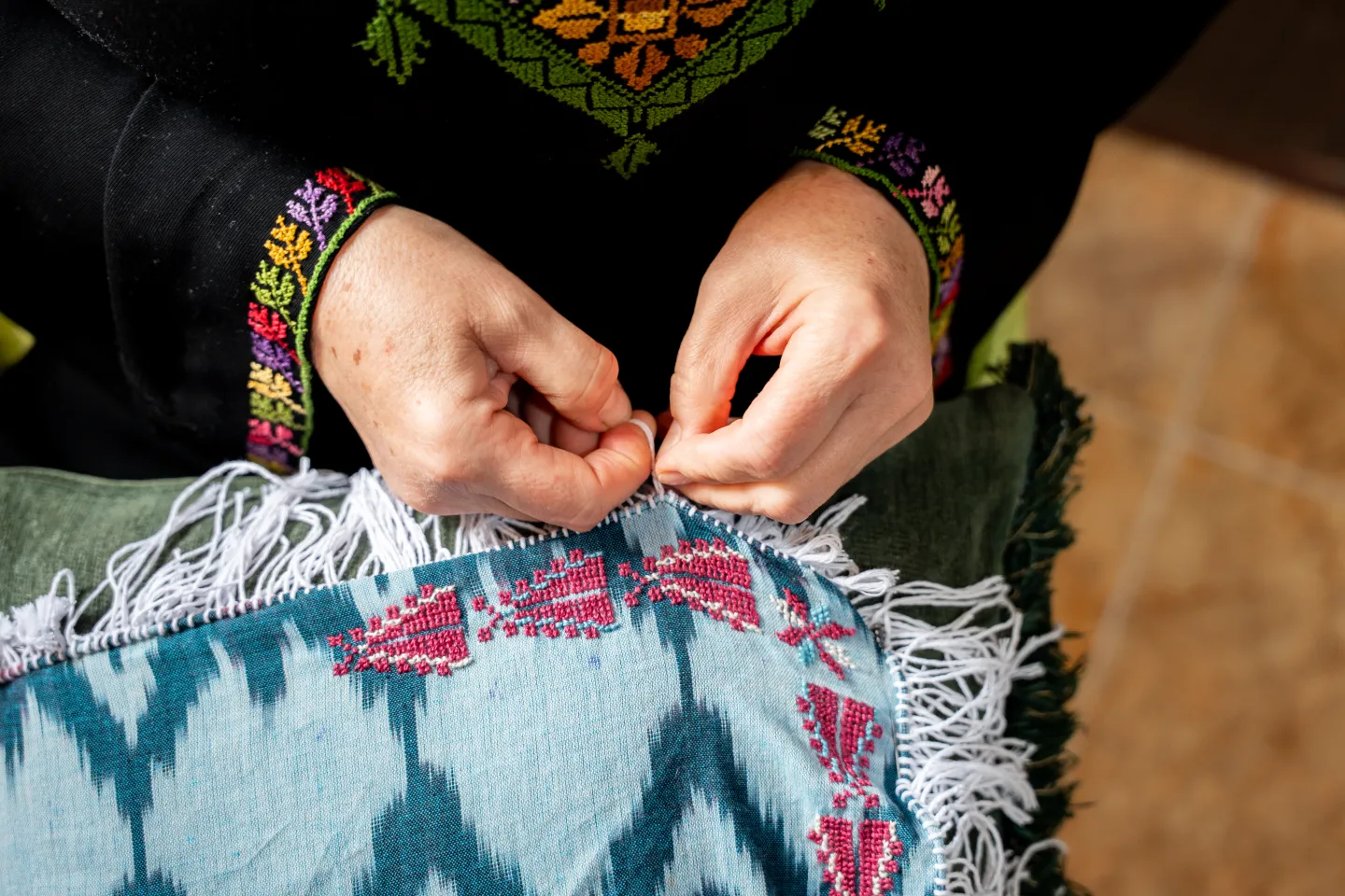 Jordanian hand embroidery work. close up of hands. 