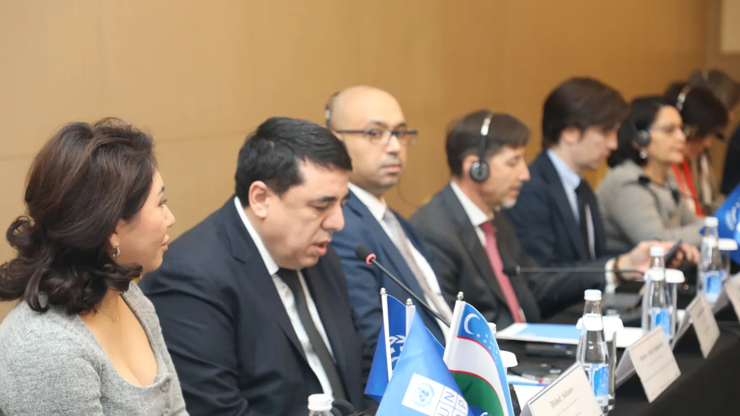 Panellists seated at a conference table during a roundtable discussion in Tashkent
