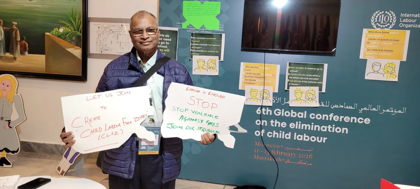A delegate to the 6th Global Conference on the Elimination of Child Labour holds a pledge on gender and the elimination of child labour