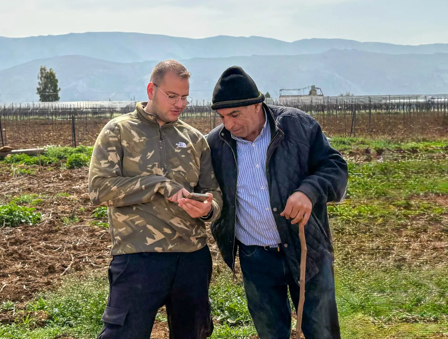 Tarek Daoud hosts neighboring farmers visiting his greenhouse to observe the sensor-based system and discuss improved irrigation and crop management practices. Bekaa, Lebanon. March, 2025