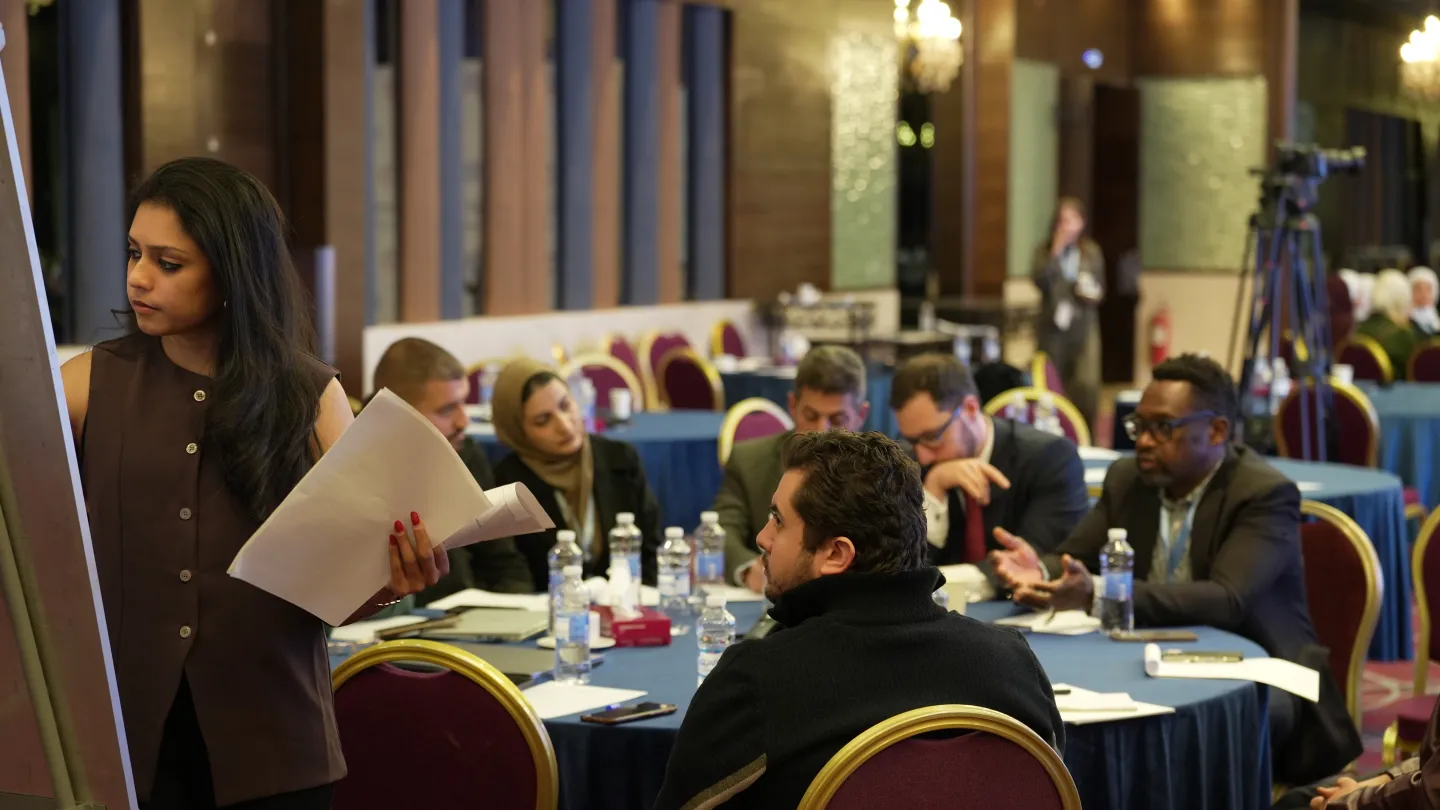 A participant records inputs during a breakout discussion session at the Forum on Just Energy Transition for Jordan.