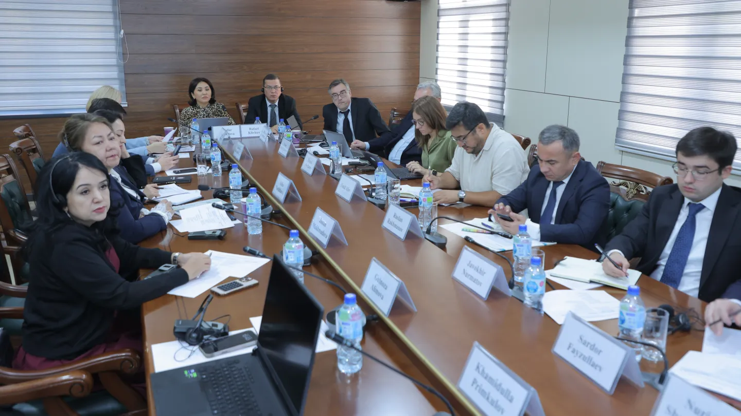 People seated around a large rectangular conference table