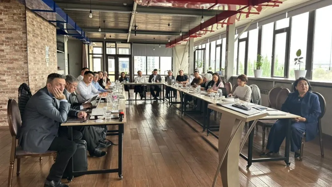 people sitting at U-shaped table