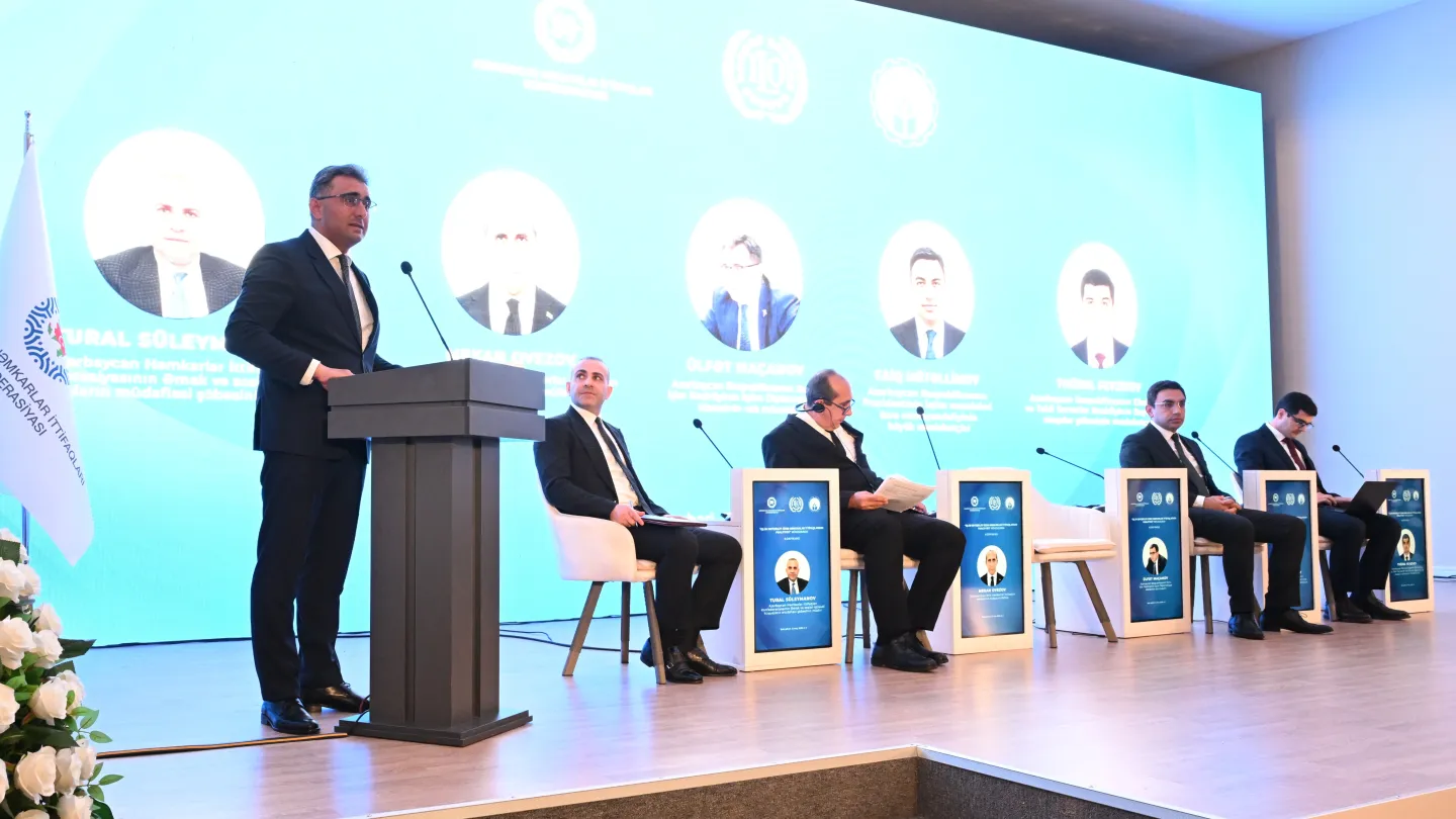 Five panellists on a podium