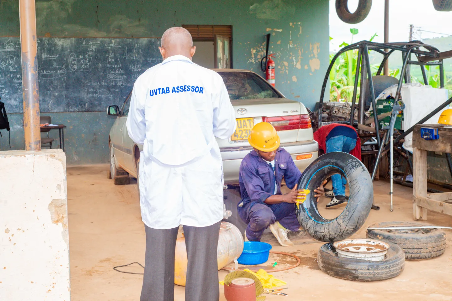 car mechanics being assessed for skills recognition
