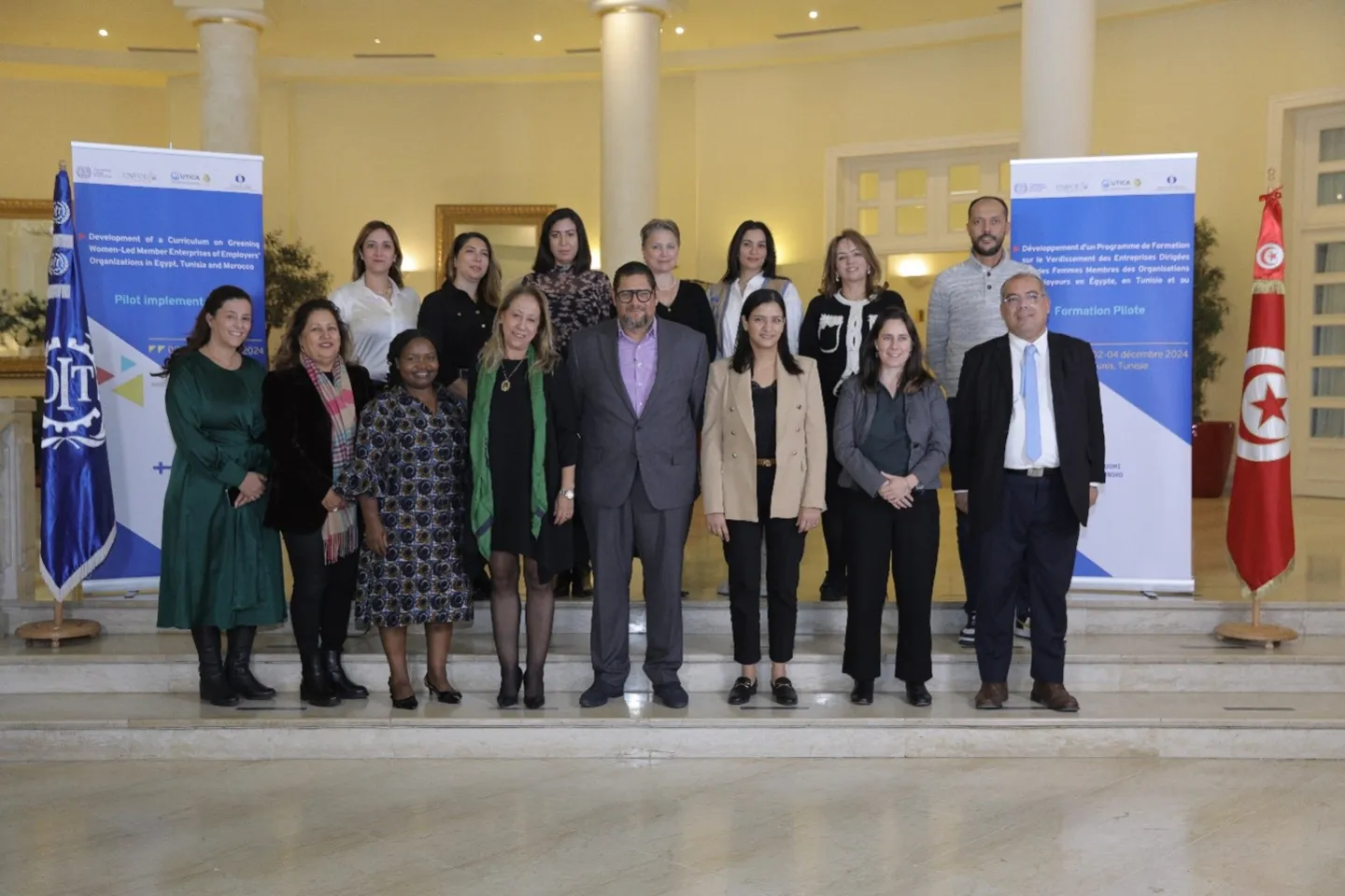 Representatives from the International Labour Organization (ILO) and CNFCE gathering for a group picture during a workshop