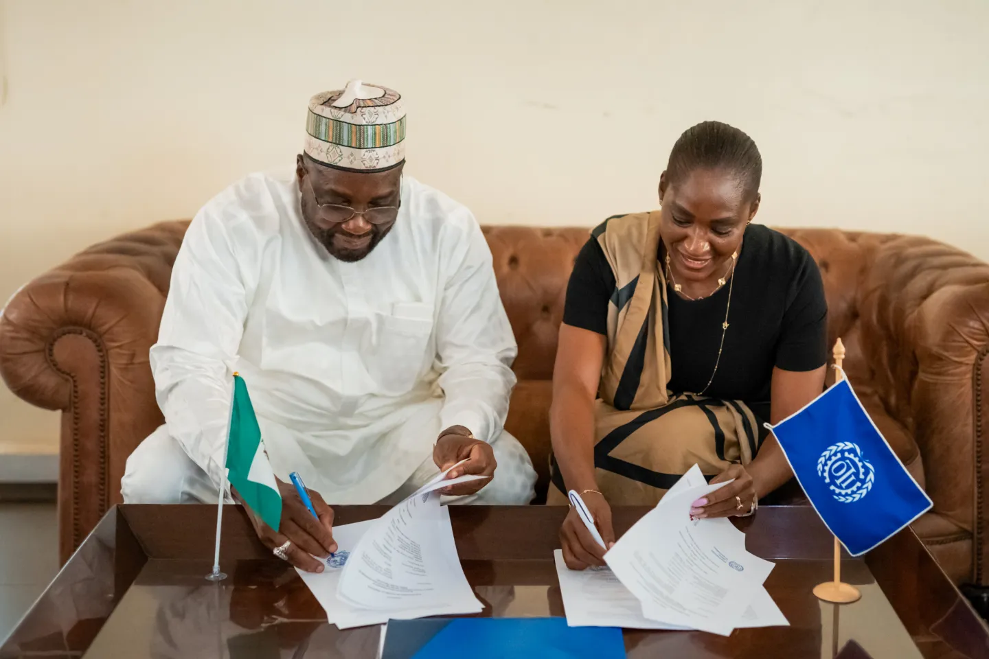 RAAMP National Coordinator Aminu Bodinga Mohammed and ILO Country Director Dr Vanessa Phala sign a partnership agreement in Abuja to support rural road maintenance and employment creation in Nigeria.