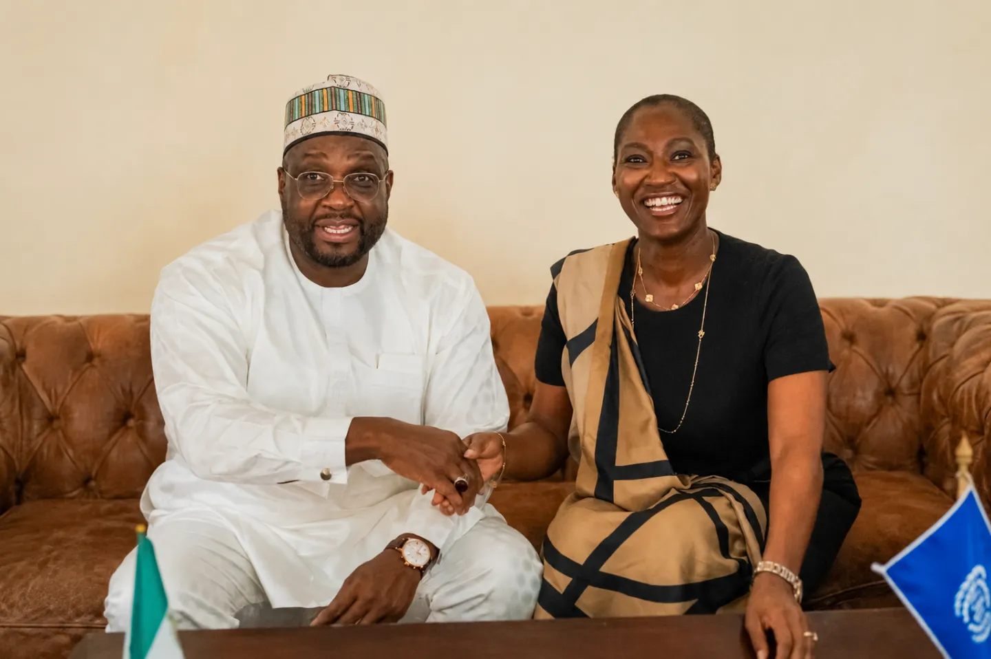 RAAMP National Coordinator Aminu Bodinga Mohammed and ILO Country Director Dr Vanessa Phala shake hands after signing a partnership agreement in Abuja.