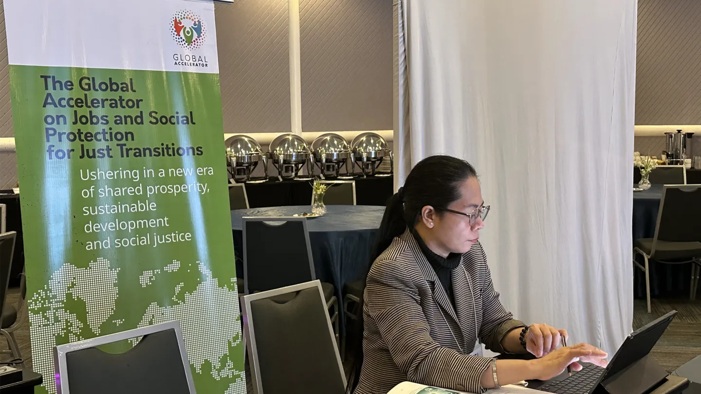 A female trade union leader sits and joins an ILO Korea master training on green skills