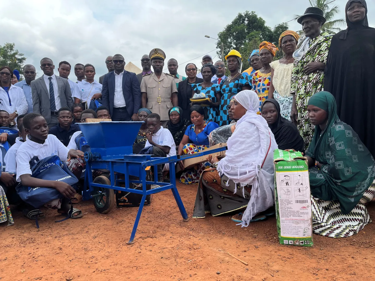 Community members in Cote d'Ivoire receive equipment