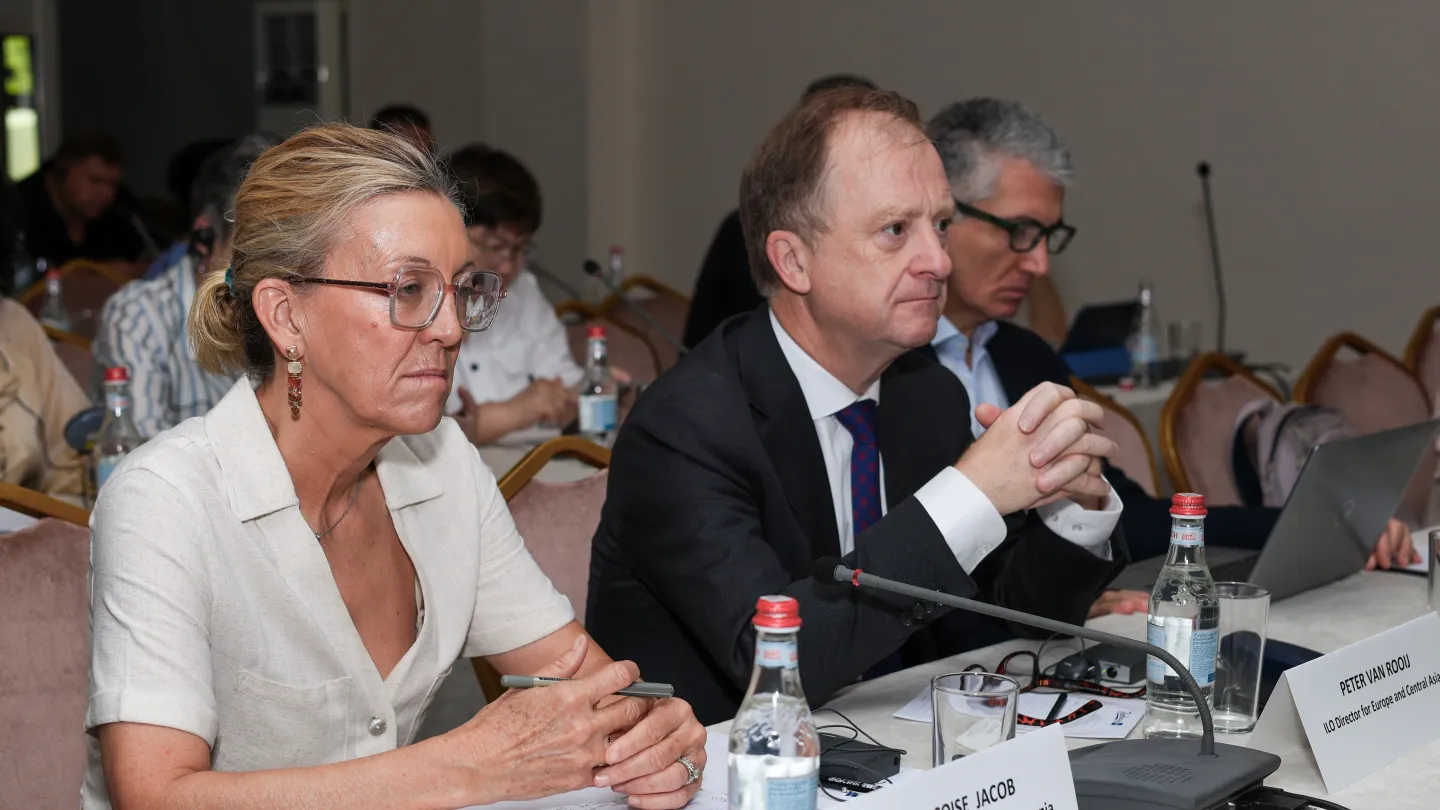 Three people sitting at a table