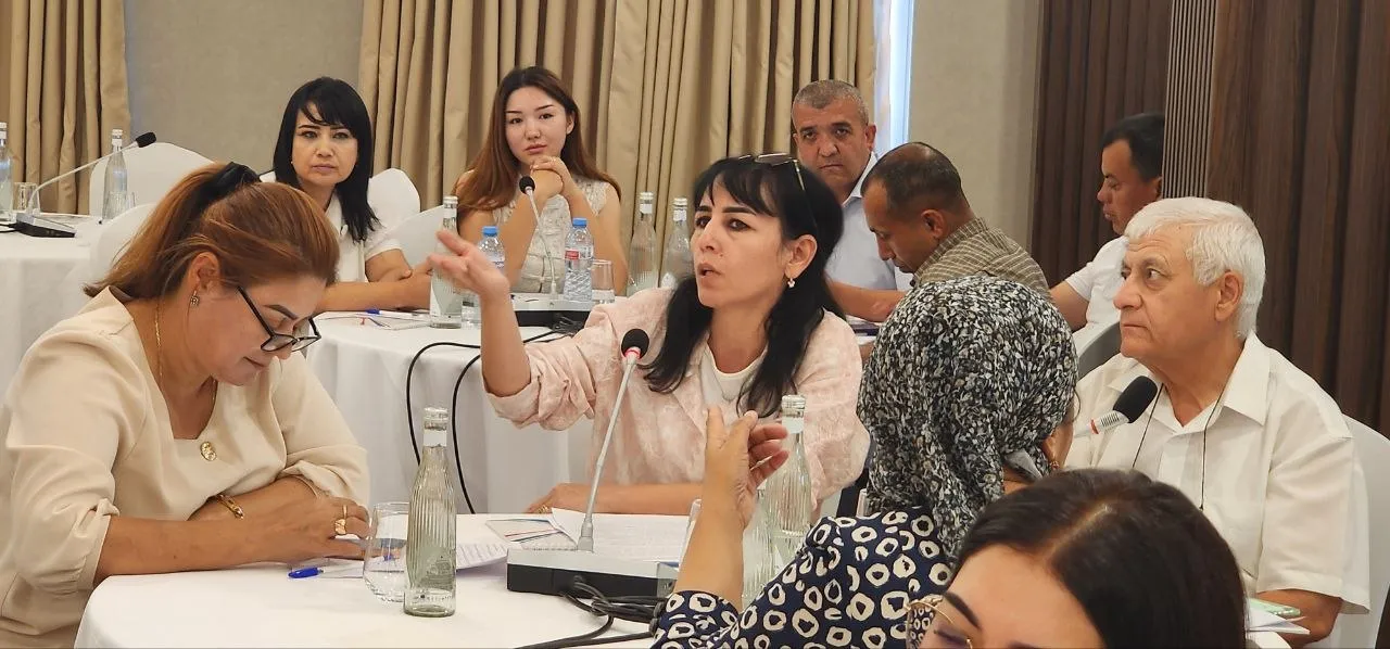 A woman is speaking from the audience