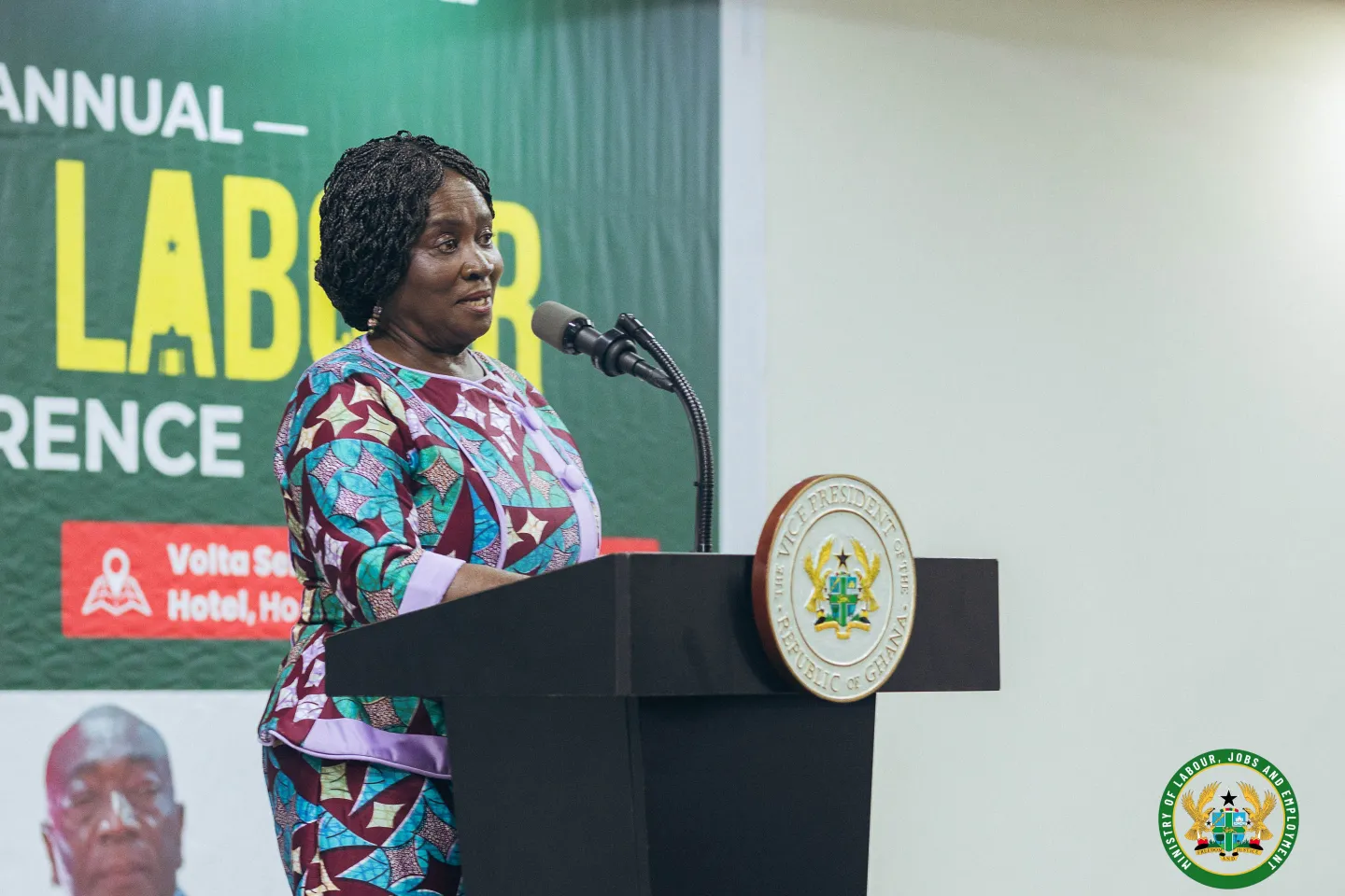 Vice President Jane Naana Opoku-Agyemang stands at a podium addressing delegates during the National Labour Conference.