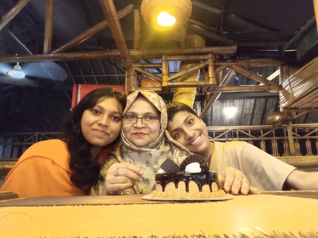 Marzan with her mother and younger brother, whose support shaped her journey