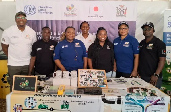 Smiling young workers at project stand