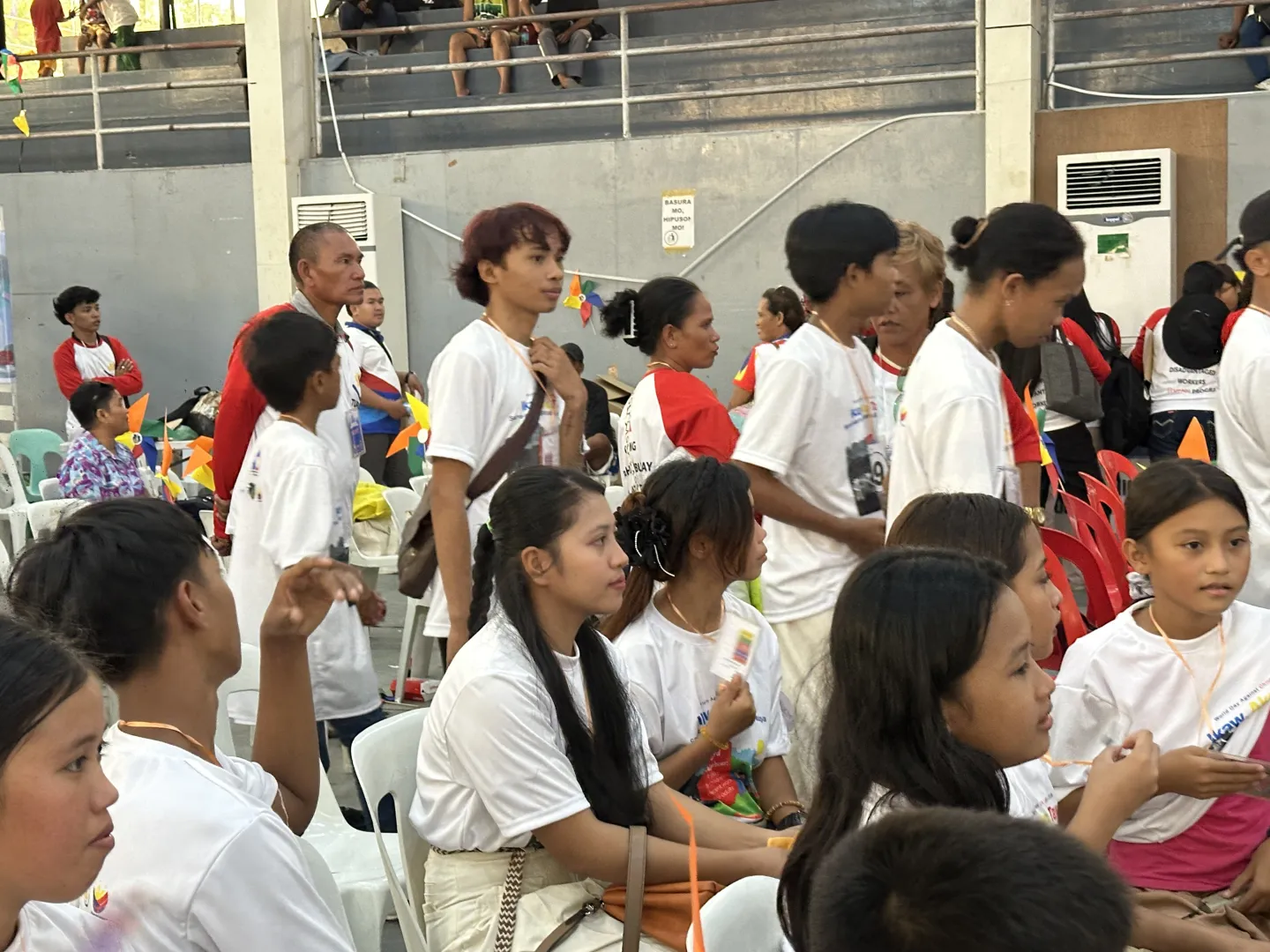 Children and their families receive government services, essential assistance, and information during a caravan in Surigao del Sur.