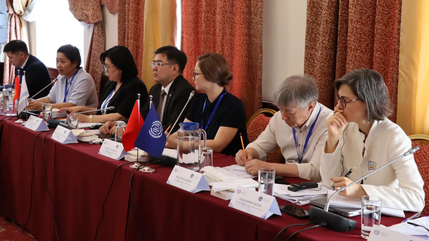 Panellists sitting at a long table