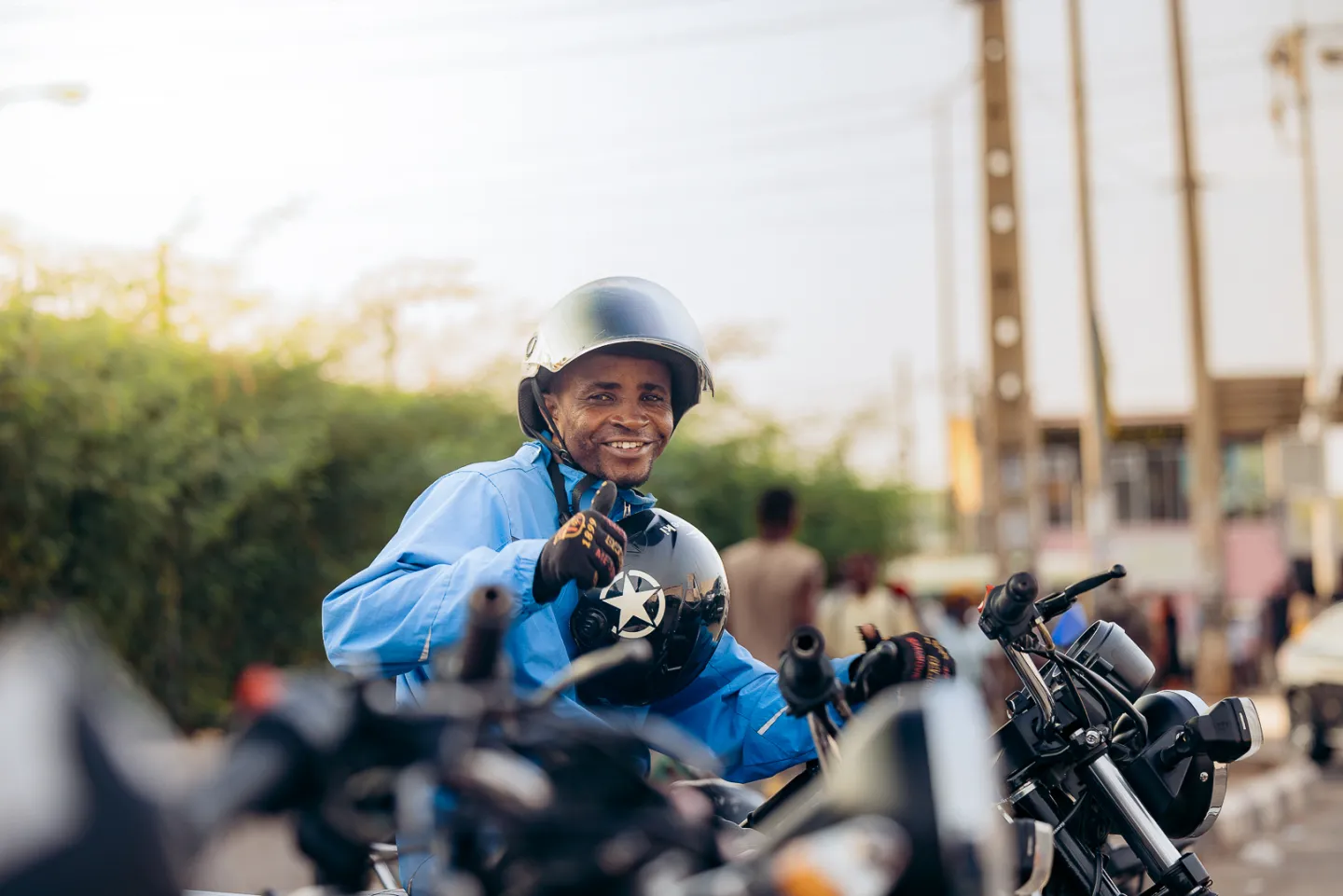 Men smiling on motorbike