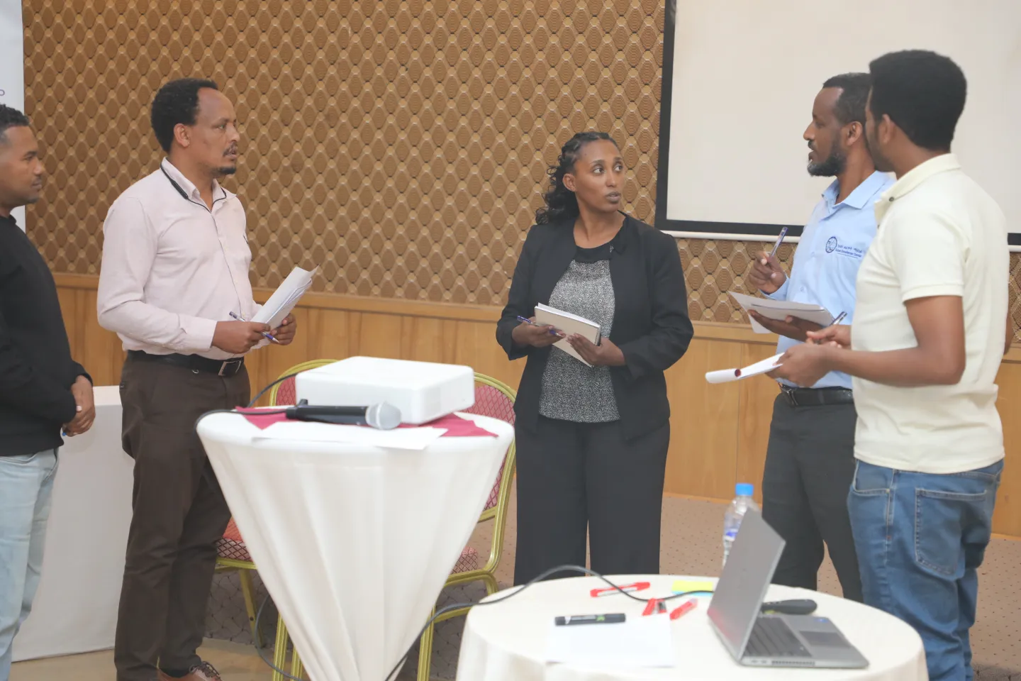 Participants actively interacting in a role play.