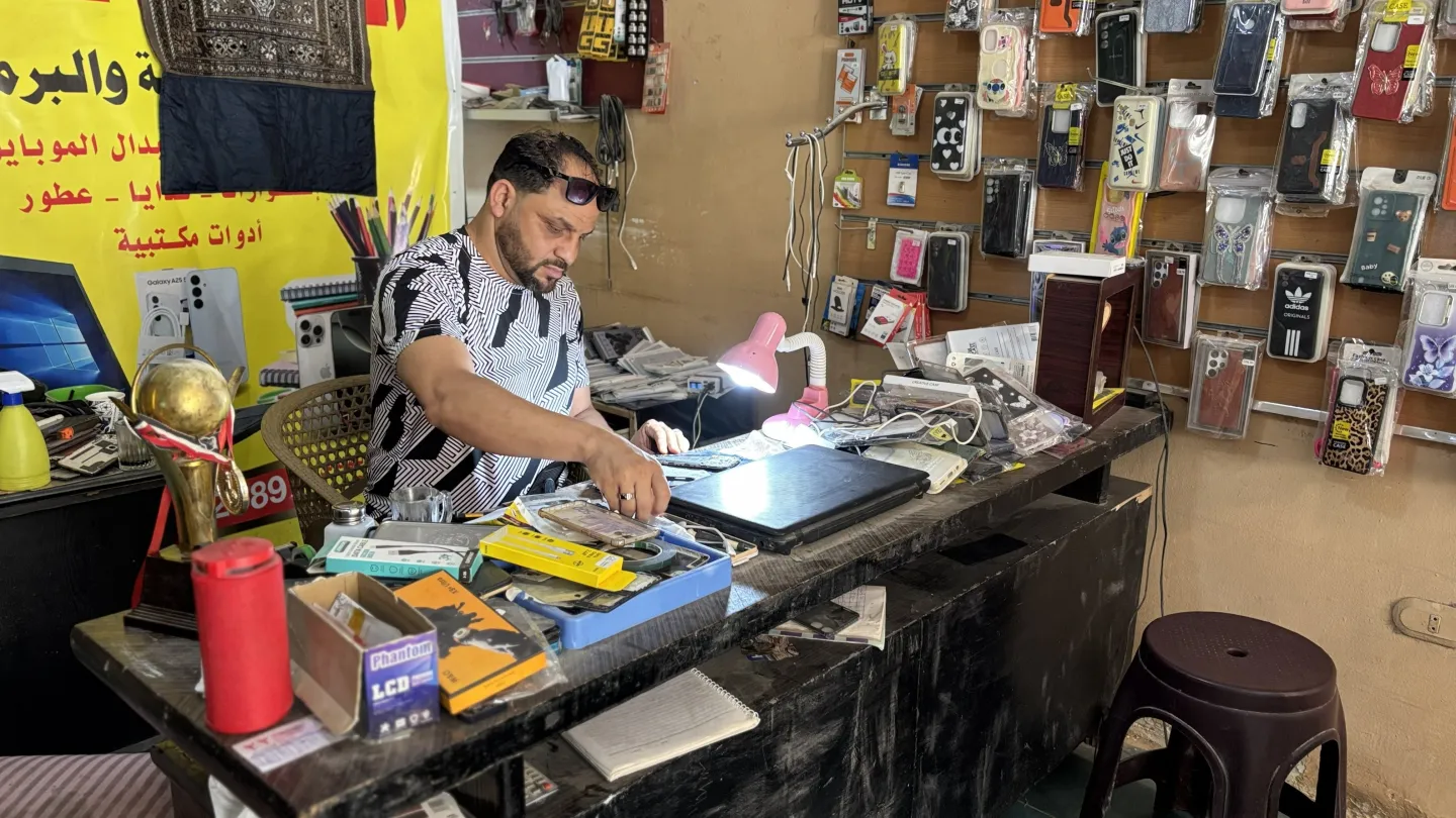 Alhassan Ali at work at his desk.  