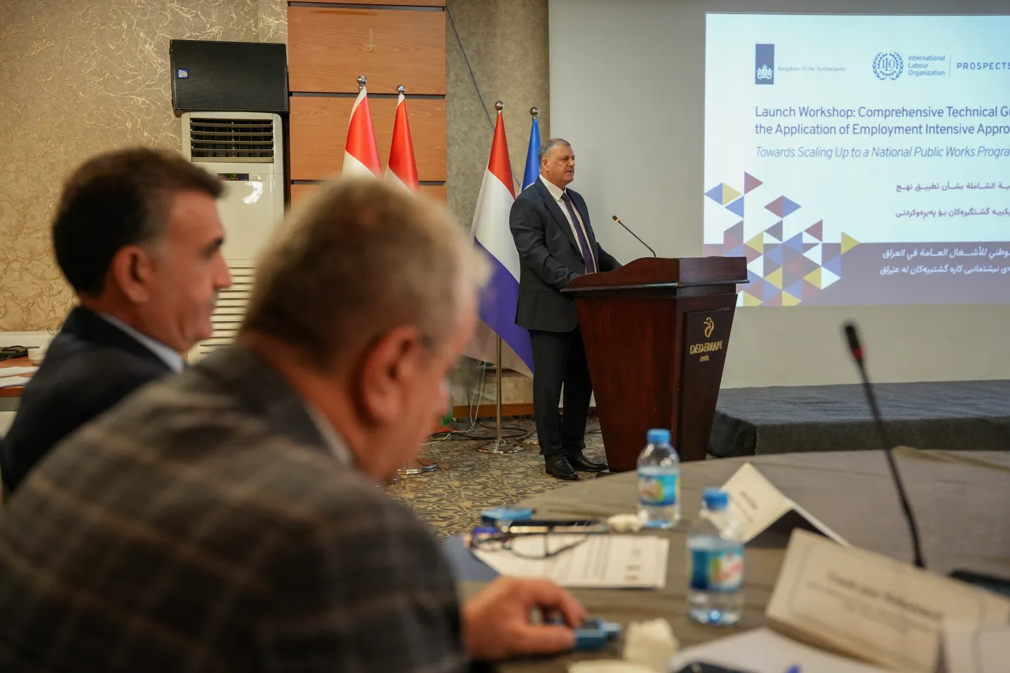 Ahmed Mohammed Hassan Al-Farraji, Head of the Experts Team at the Ministry of Planning, speaking at the launch of the EIIP Guidelines in Erbil, Iraq. 9/9/2026