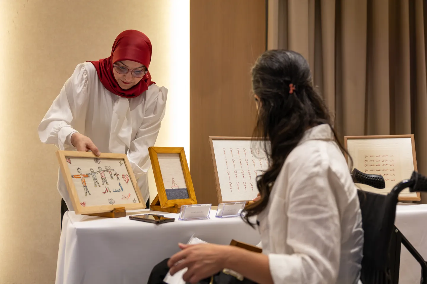 Visitors engage with a participating entrepreneur and explore locally produced items showcased during the exhibition.