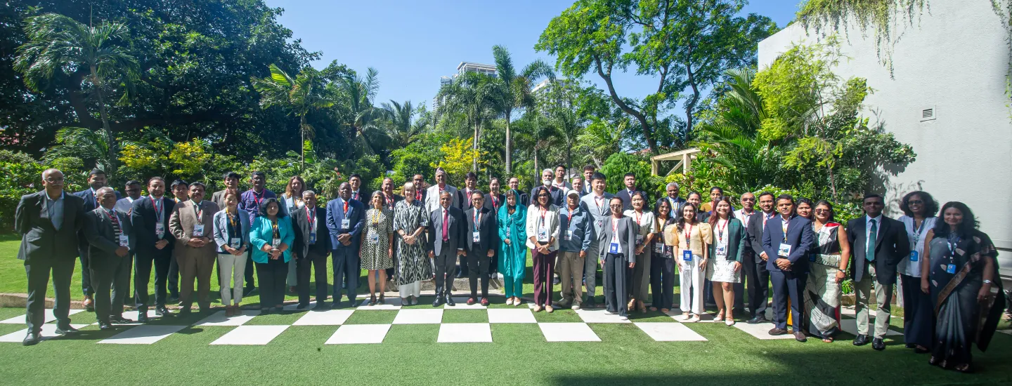 Workshop participants pose for a group photo.