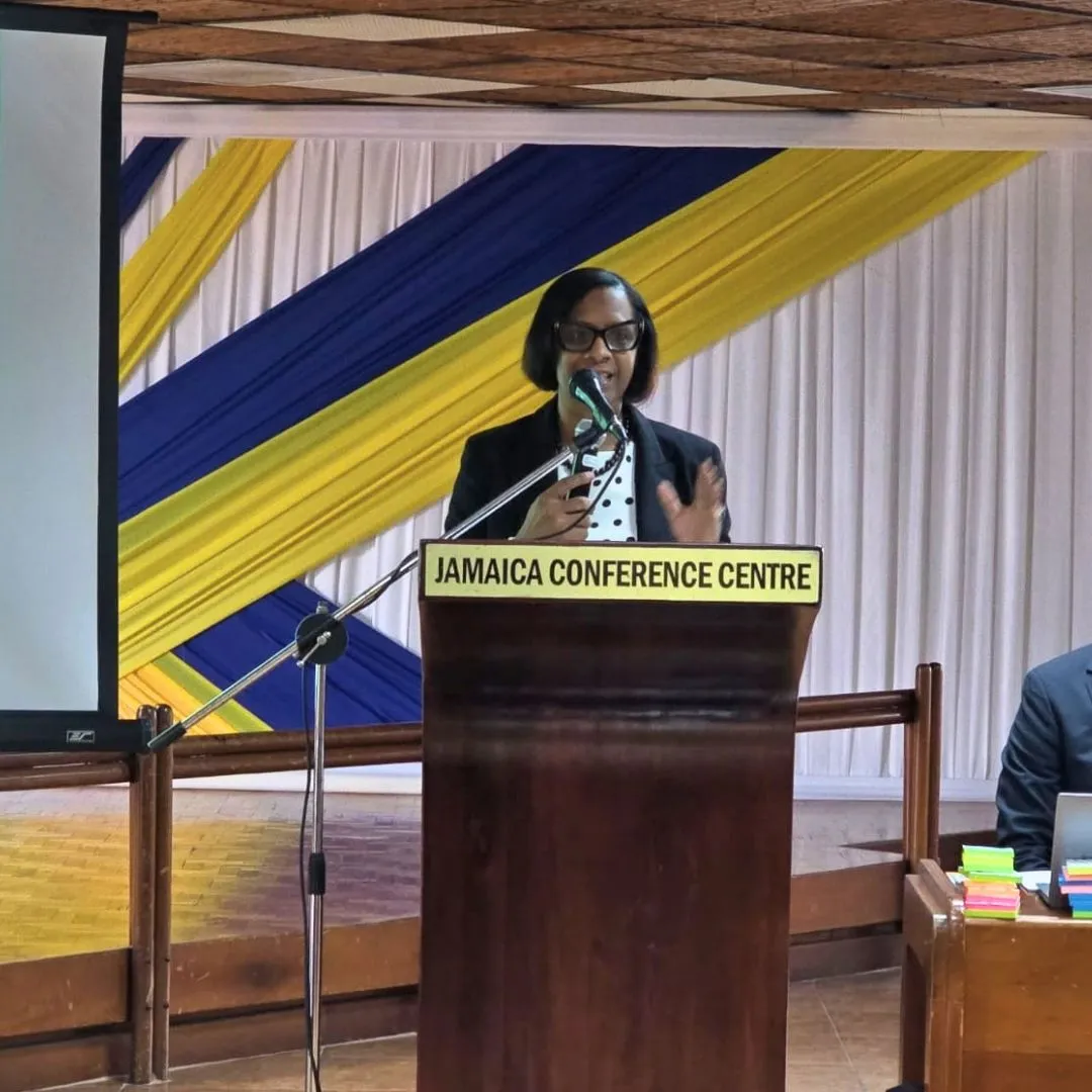 Lady standing at podium delivering speech