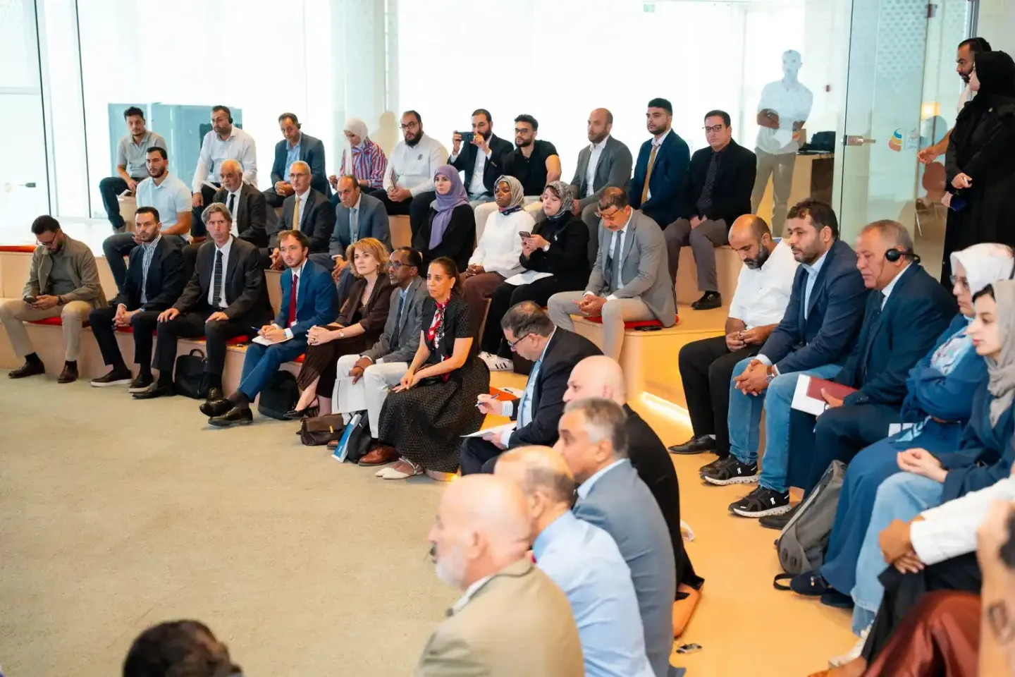 A group of participants seated in an auditorium during a workshop in Tripoli, Libya.