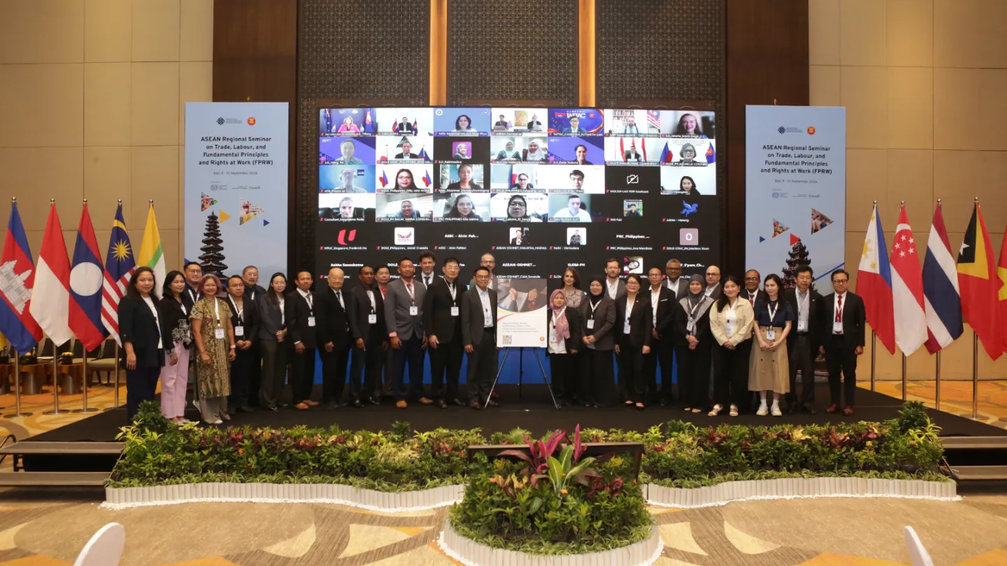 Participants in the seminar pose for a group photo