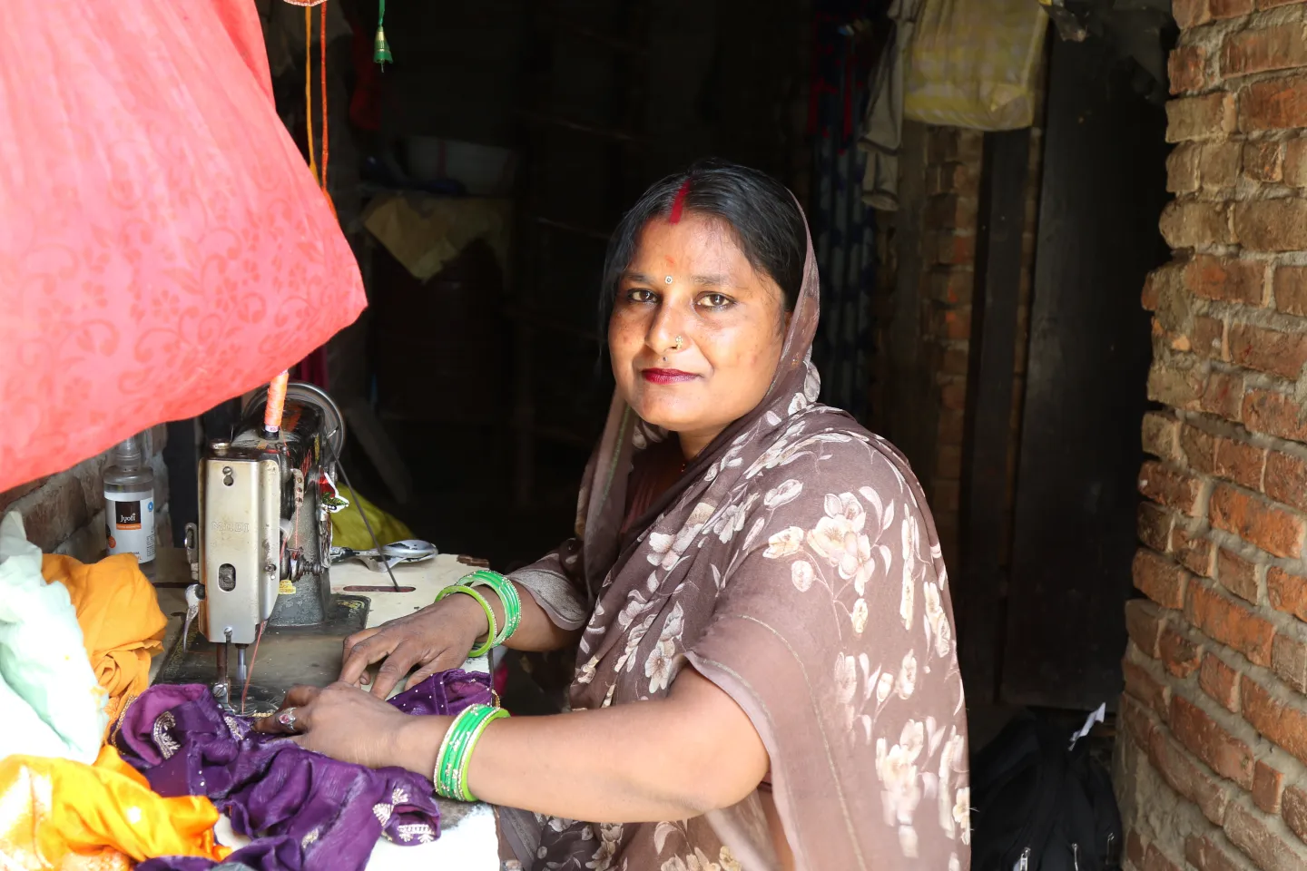 Jayamala puts her sewing skills to work.