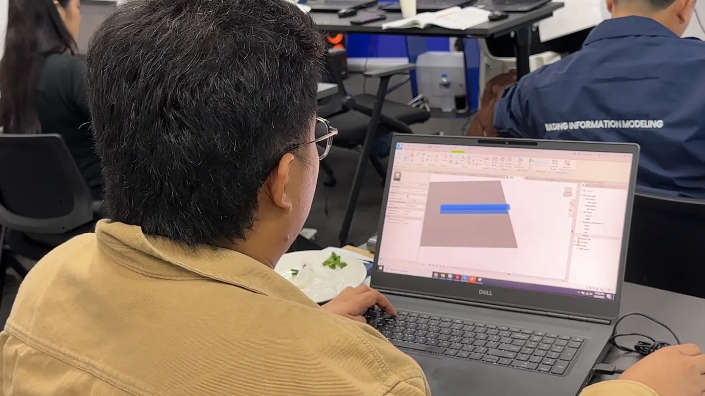 Architect Magcalas using a computer with the Building Information Modeling.