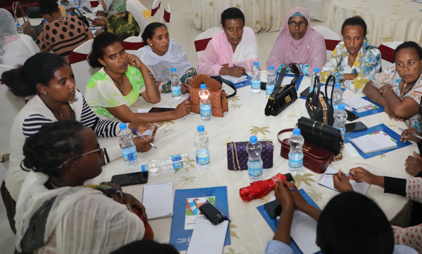 Participants engaging in a group work to develop action plans