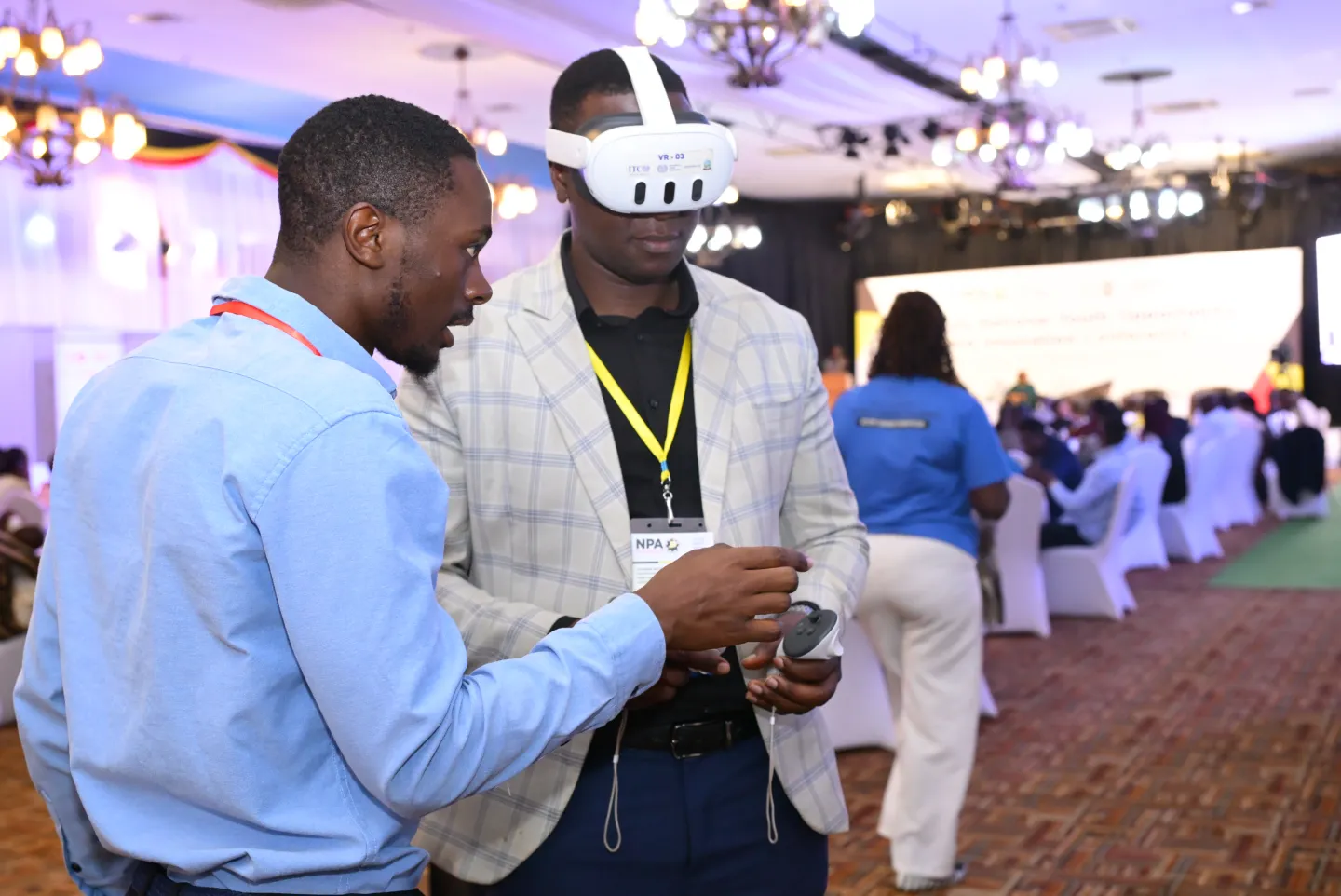 a participant at the conference in Uganda trying VR set