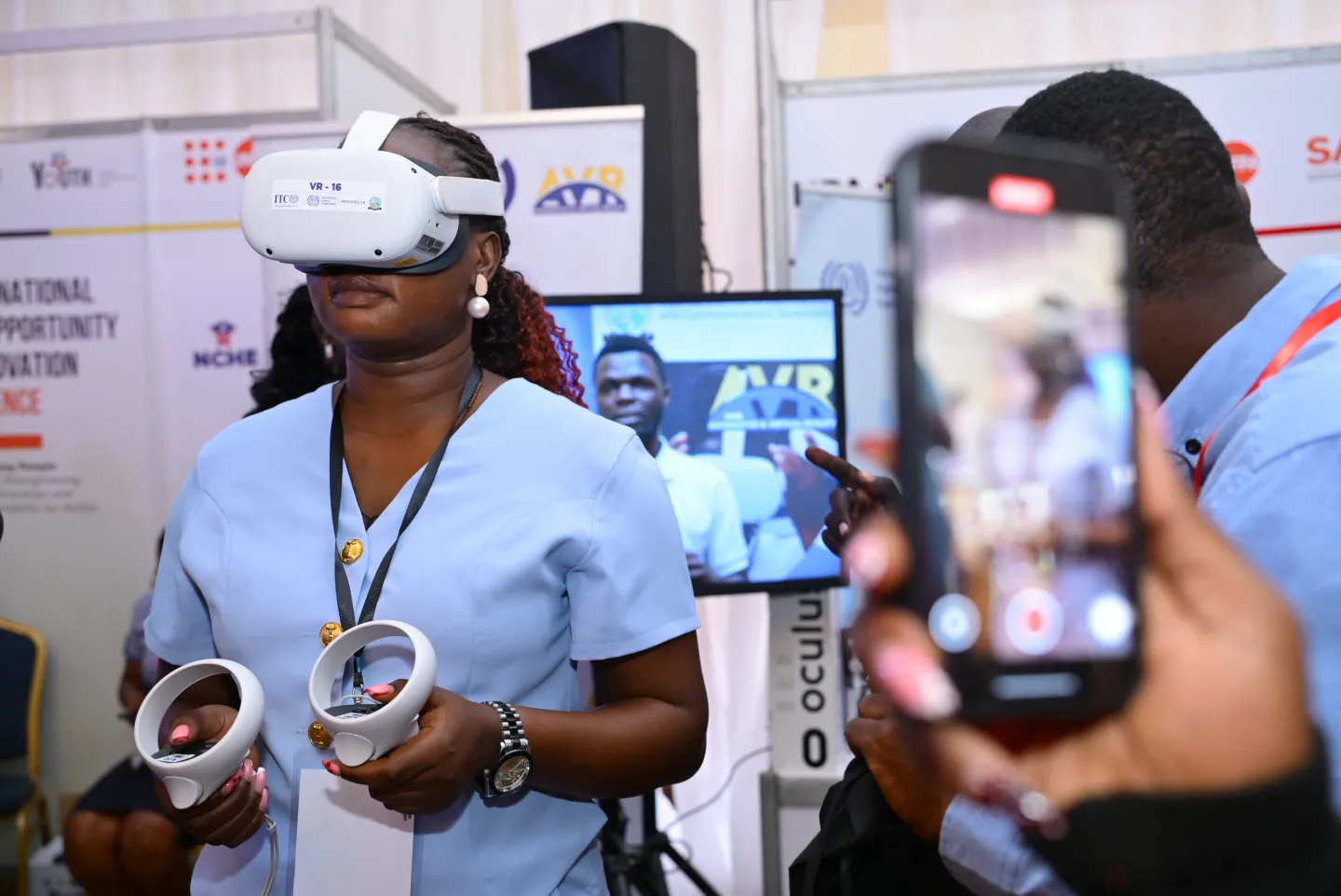 woman trying Virtual reality set at an event in Uganda