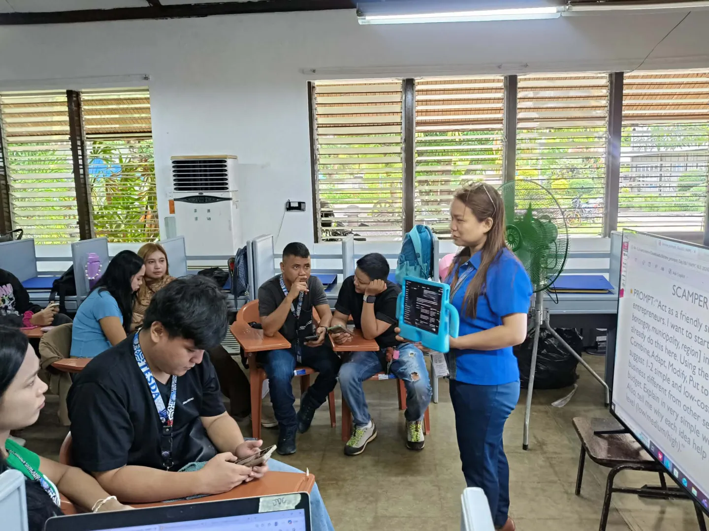 Lea Macababbad teaches AI and digital skills in a TESDA classroom.