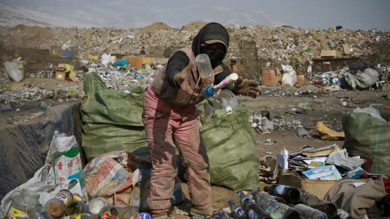 Waste is sorted by hand at a garbage dump. 