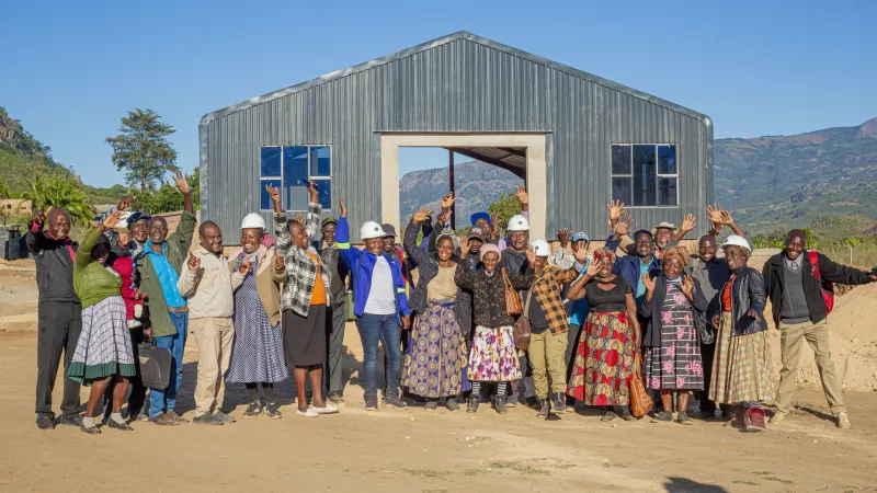 a group of people waving