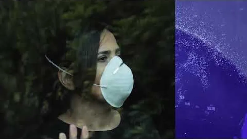 A masked person beside an abstract purple graphic.